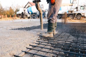 Concrete worker laying a foundation for a business in Apopka